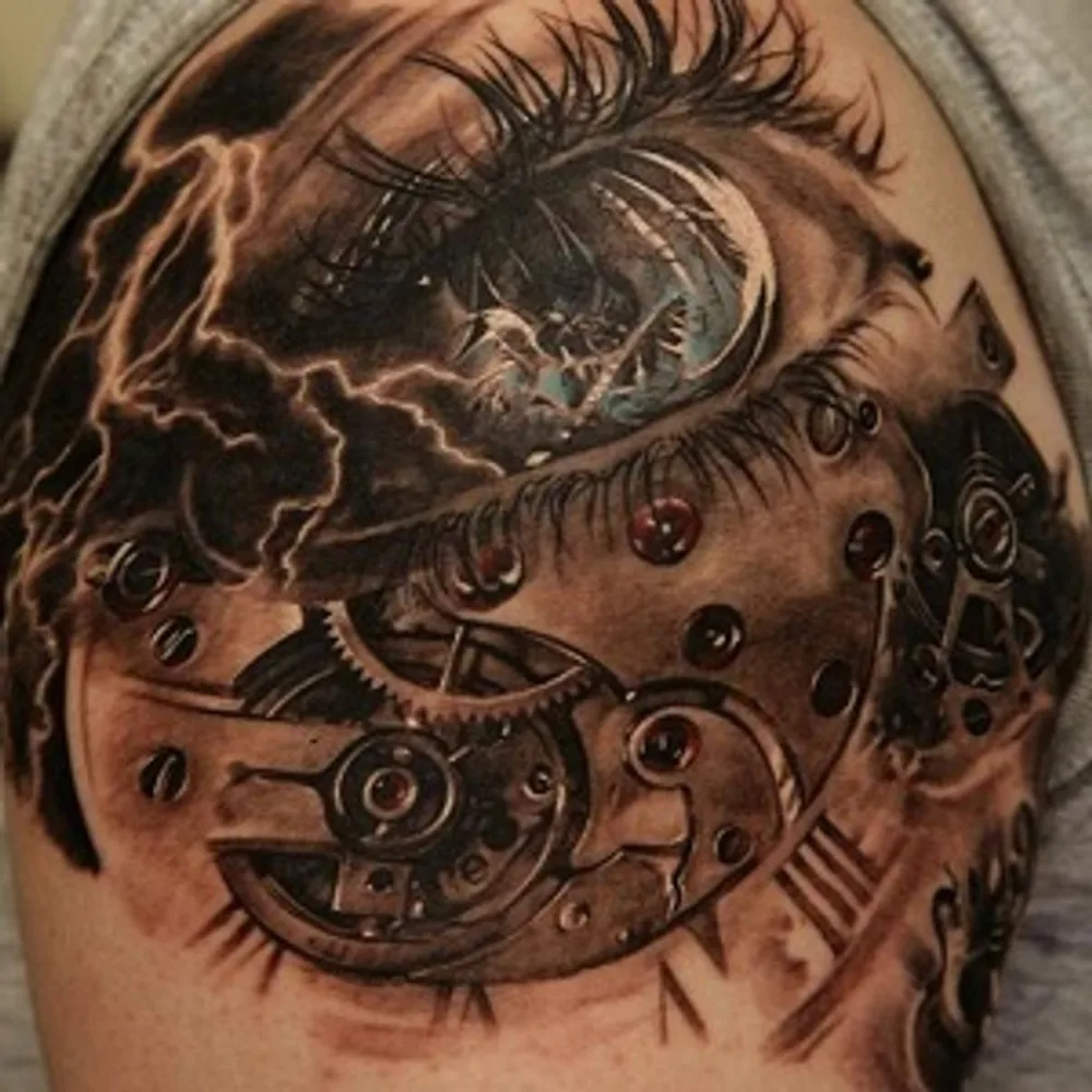 Realistic tattoo of an eye with clockwork and lightning details on a shoulder